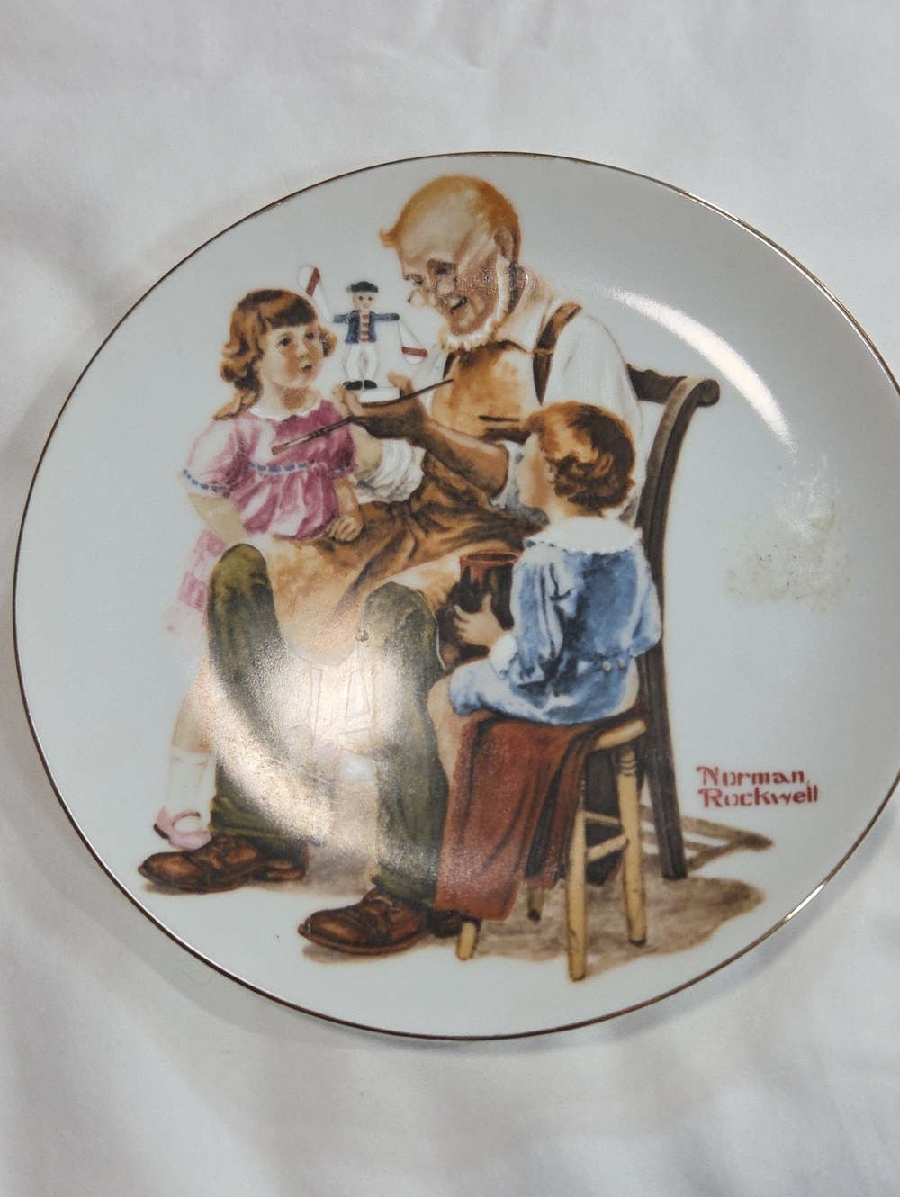 Norman Rockwell Decorative Dinner Plate with White, Brown, Pink, Blue Accents